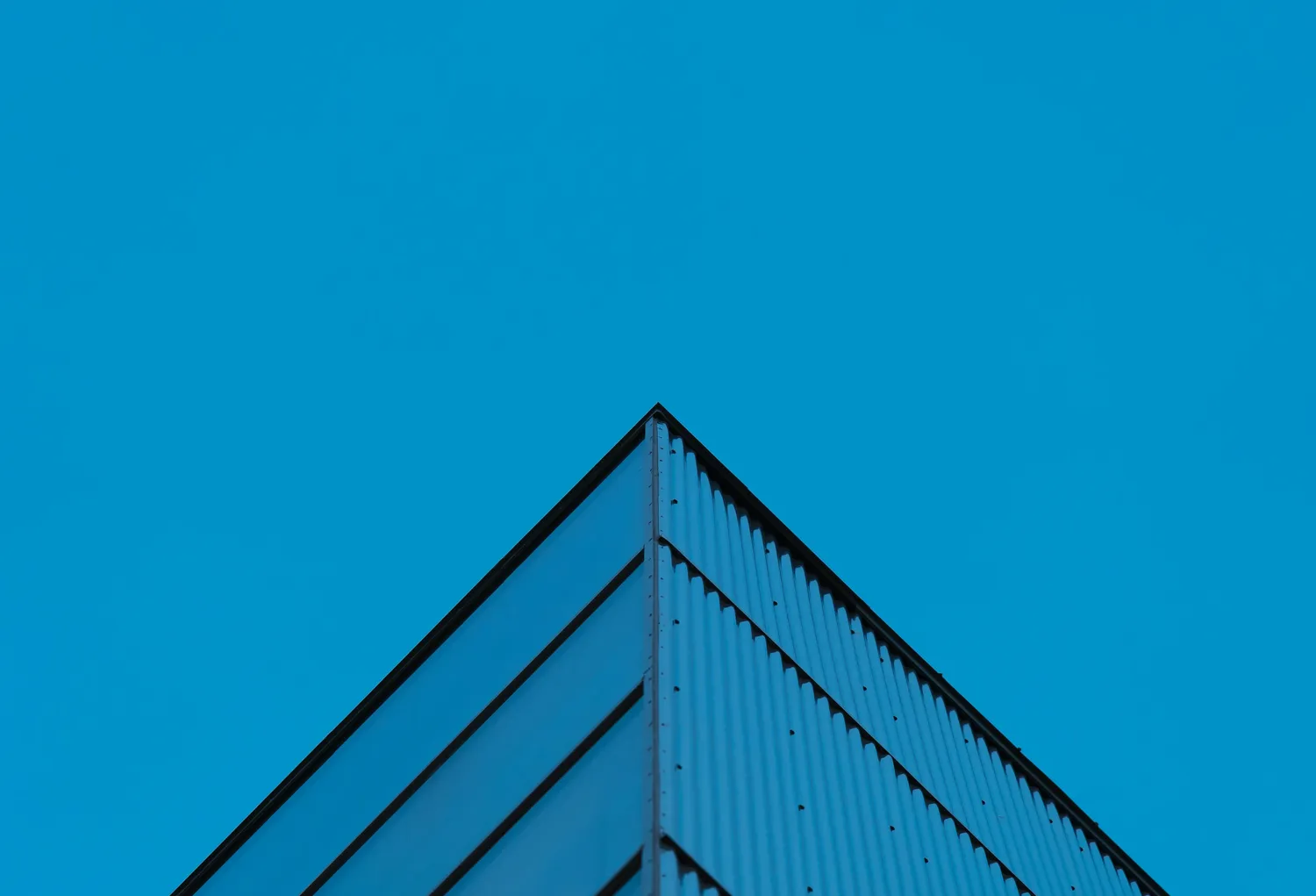 Modern architecture against blue sky — clarity for the bold